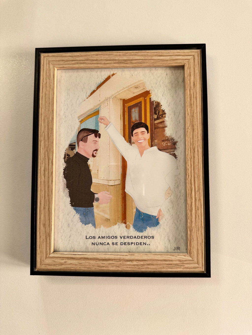 Ilustración minimalista de pareja desde foto de espaldas frente al mar con marco negro moderno.