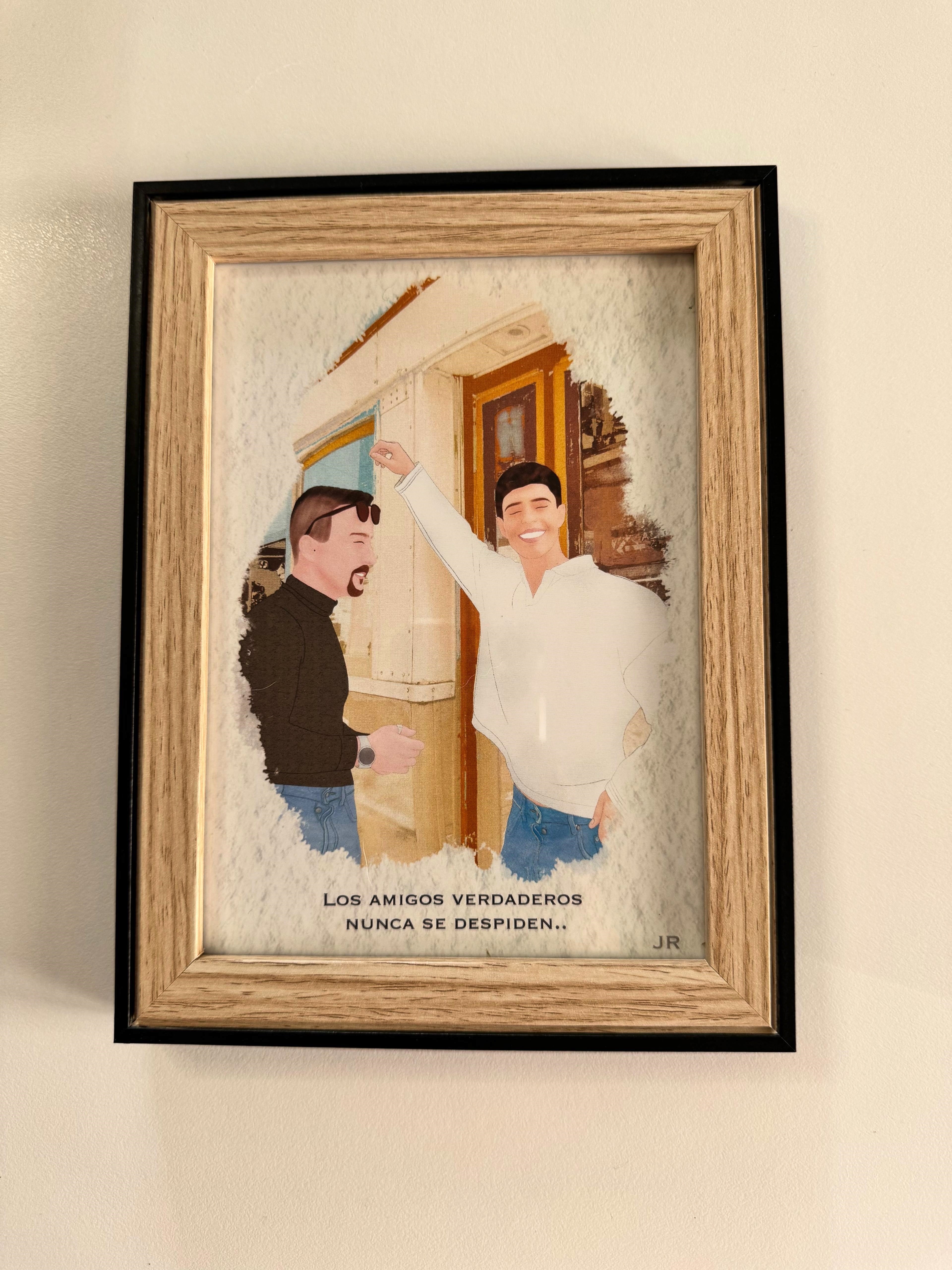 Ilustración minimalista de pareja desde foto de espaldas frente al mar con marco negro moderno.